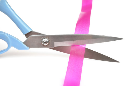 Cutting pink ribbon