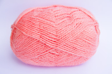 Pink ball of woollen thread isolated on white