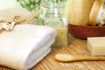 Bath salt and towel on bamboo mat spa concept still life