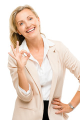 Mature woman giving okay sign isolated on white background