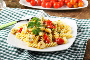 Fusilli with fresh shrimp, peas and tomatoes