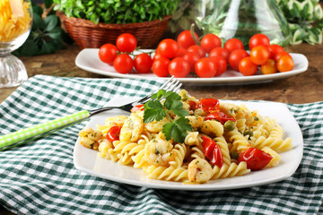 Fusilli with fresh shrimp, peas and tomatoes