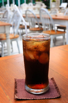 A glass of cola on a table