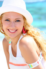 Cheerful girl in vacation at the beach