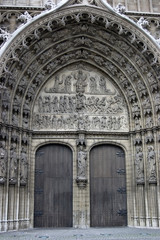 Fototapeta na wymiar Bronze door entry to famous Vrouwekathedraal - Cathedral of our