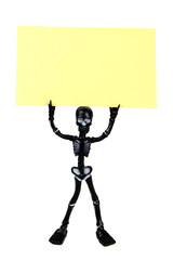 Skeleton holding a post it