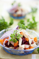 salad with roasted vegetables and salted herring