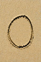 Number handwritten in sand