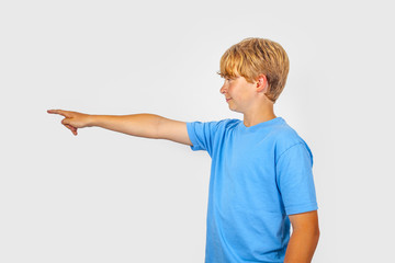 boy showing with his arm in the foreward direction