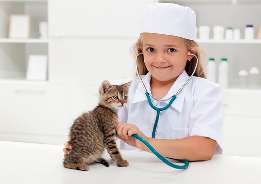 Little girl playing veterinary