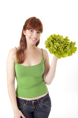 Beautiful woman with lettuce salad