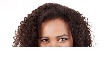 Young african american woman with blank signboard, isolated on w