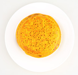 pancakes in a plate on white background