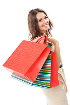 Young happy woman with shopping bags, isolated