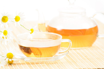 teacup with herbal chamomile tea