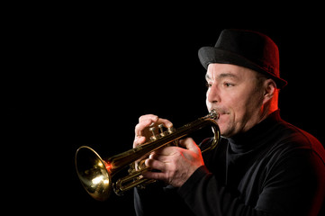 An image of a man playing the trumpet