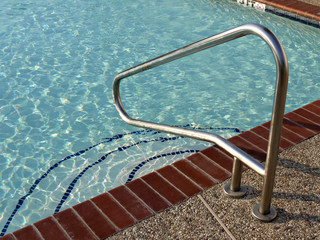 Metal handrail at a swiming pool
