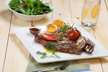 Piece of Medium Rare Steak with Spicy Herb Sauce