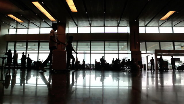 airport’s hall with crowd of people in time lapse shot