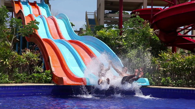 boy and girl on water slides