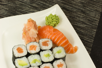 Maki rolls and nigiri sushi on a plate