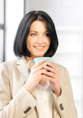 lovely businesswoman with mug