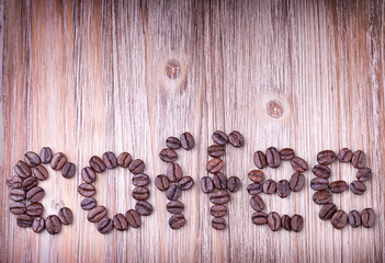 The word COFFEE made out of  coffee beans