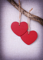 Two red wooden hearts