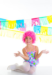 child kid girl with party clown pink wig funny expression