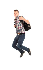 casual young man jumping on white