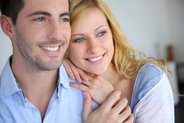 Cheerful in love couple at home