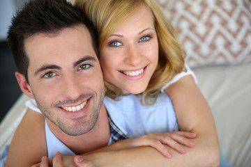 Portrait of cheerful in love couple at home