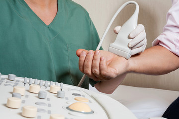Technician Scanning Male Patient's Hand