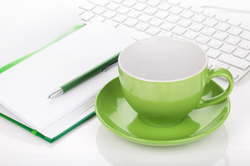 Coffee cup and office supplies