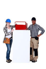 Workers with a toolbox and blank board