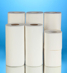 Rolls of toilet paper on blue background