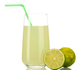 Delicious lemon juice in glass and limes next to it isolated