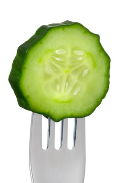 cucumber slice on a fork isolated