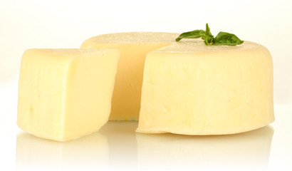 sliced mozzarella cheese with green basil isolated on white