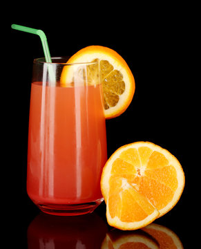 Glass Of Orange Cocktail Isolated On Black