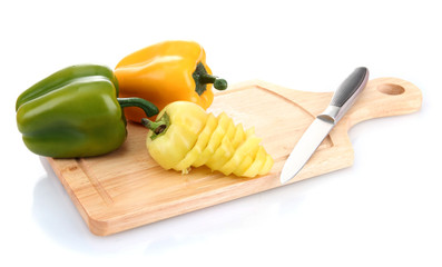 paprika and knife on wooden cutting board isolated on white