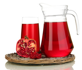Full glass and jug of pomegranate juice and pomegranate