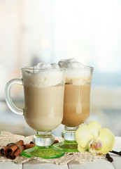 Fragrant coffee latte in glasses cups with spices,