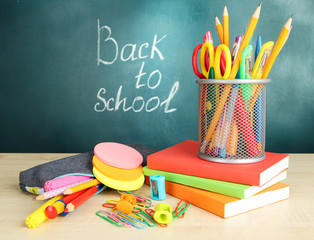Back to school - blackboard with pencil-box and school