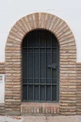 Fototapeta na wymiar Large window or door with grate and metal mesh