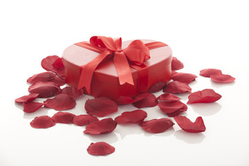 Valentines Day gift in red box with rose petal
