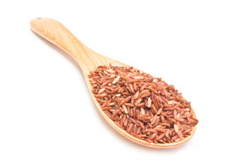 Brown rice with wooden spoon isolated on white background.