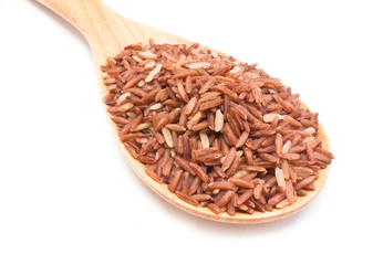 Brown rice with wooden spoon isolated on white background.