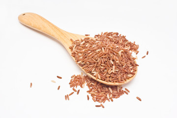 Brown rice with wooden spoon isolated on white background.