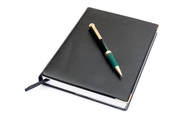 pen and notebook on white
